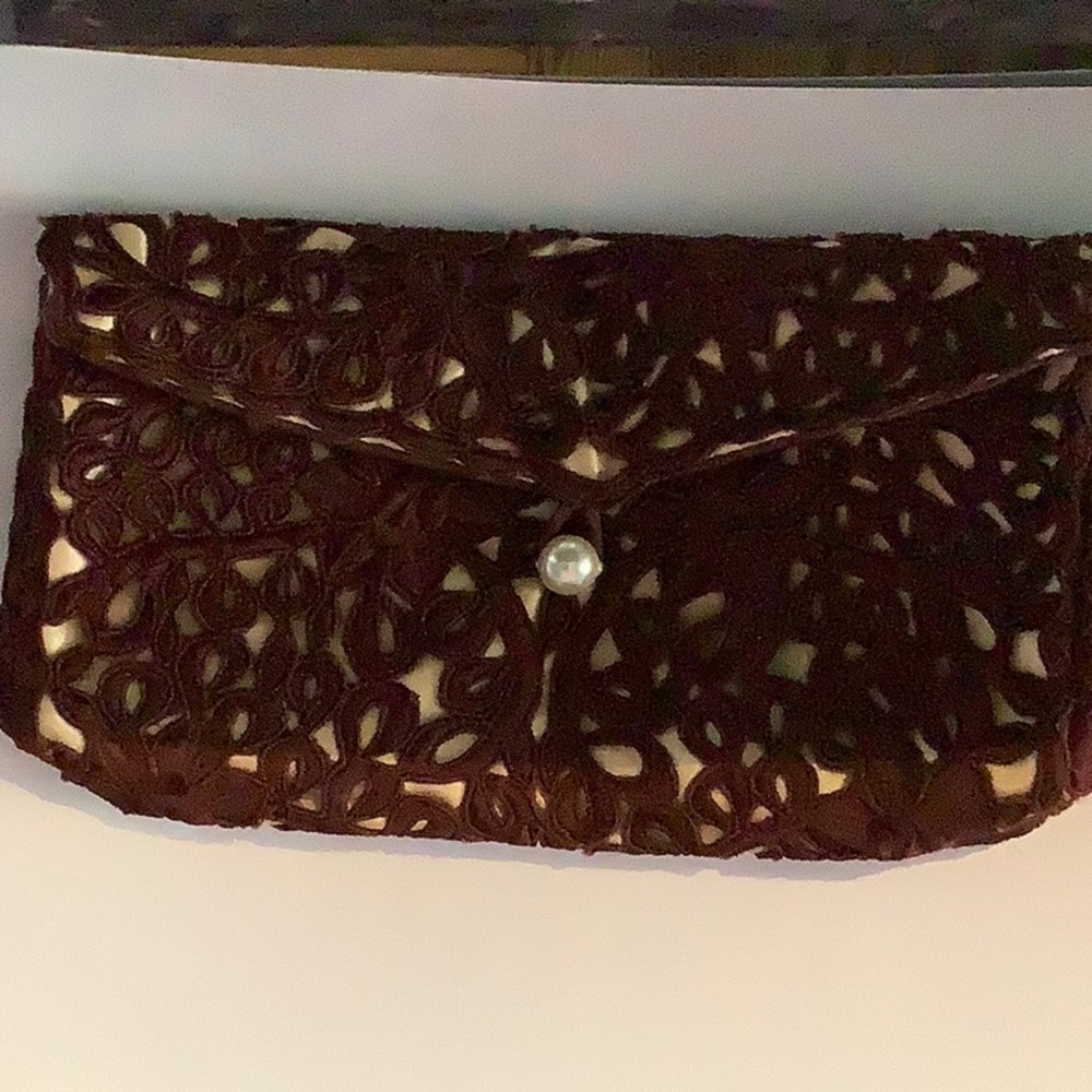 Brown cut-work clutch. Evening bag.